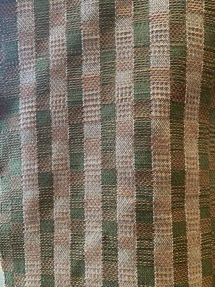 Housewarming throw woven from the building facade