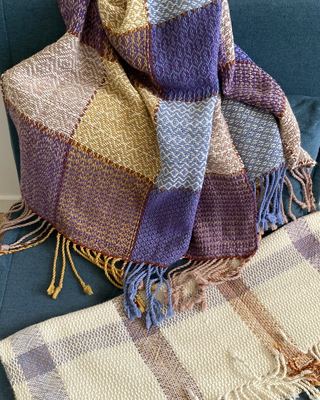 Baby blankets woven to match Iris's nursery